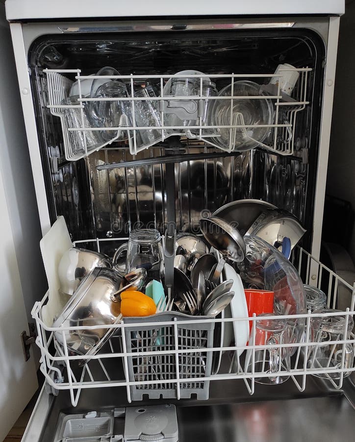 Dishwasher Front View. Clean Dishes in the Dishwasher Closeup Stock