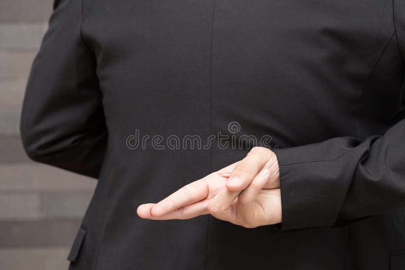 Dishonesty, Business fraud concept, Businessman showing fingers royalty free stock photography Dishonesty, Business fraud concept, Businessman showing fingers royalty free stock photography