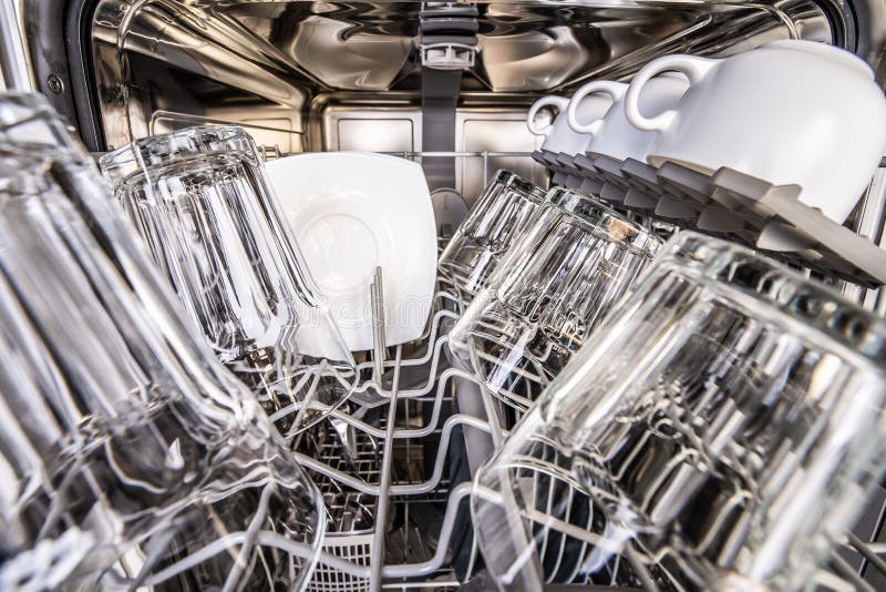 Dishwasher with clean shiny cups royalty free stock photos