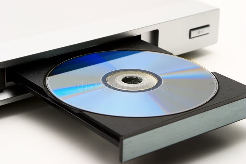 Disk drive in DVD player on a white background. Light shade.