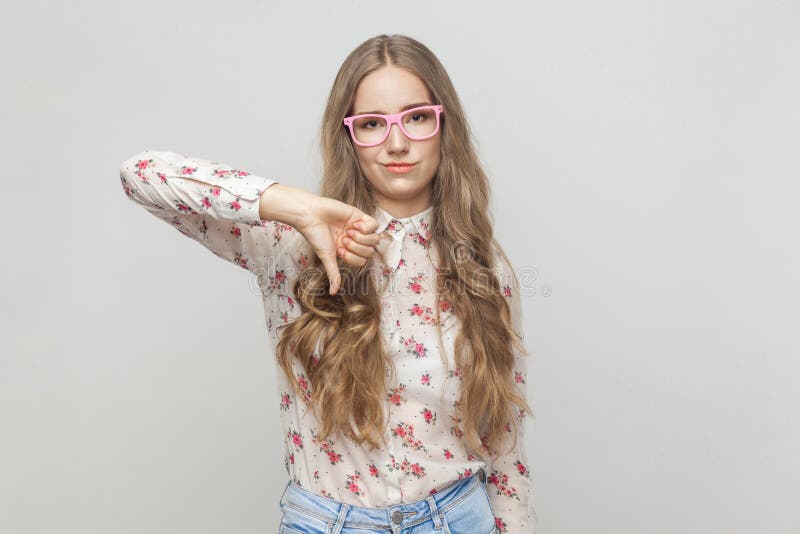 Dislike sign. Beautiful girl demonstrating dislike royalty free stock photos Dislike sign. Beautiful girl demonstrating dislike royalty free stock photos