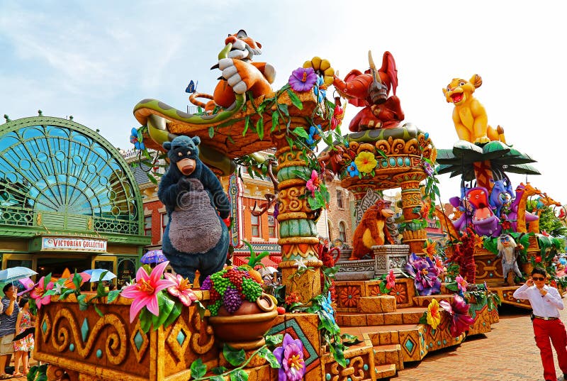 Disney parade of disneyland, hong kong. A scene from the disney flights of parade at main street of disneyland, hong kong with characters such as baloo the bear stock image