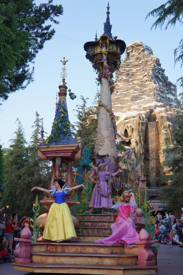 Thousands of visitors at Disneyland each day line up to watch the Fantasy Parade. This castle float has Snow White, Rapunzel, and Aurora. Thousands of visitors at Disneyland each day line up to watch the Fantasy Parade. This castle float has Snow White, Rapunzel, and Aurora.