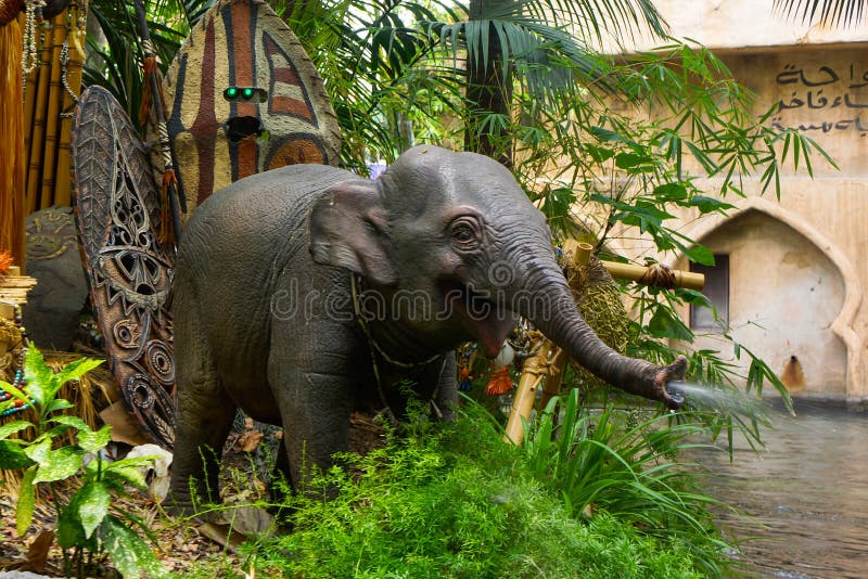 Disneyland Jungle Cruise ride features lions, hippos, waterfalls, African natives and more as the steamer boat navigates the river ways. Baby elephant squirts water at visitors at their boat returns to the dock at the end of the ride. Disneyland Jungle Cruise ride features lions, hippos, waterfalls, African natives and more as the steamer boat navigates the river ways. Baby elephant squirts water at visitors at their boat returns to the dock at the end of the ride.
