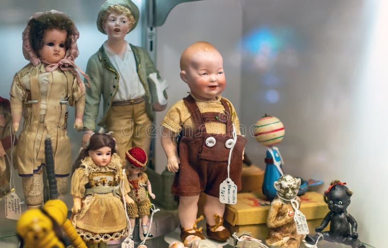 Display of Antique Dolls at an Antique Shop Editorial Photography