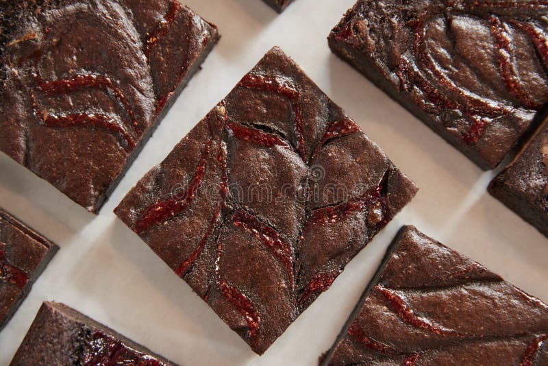 Display Of Freshly Baked Raspberry Swirl Brownies In Coffee Shop