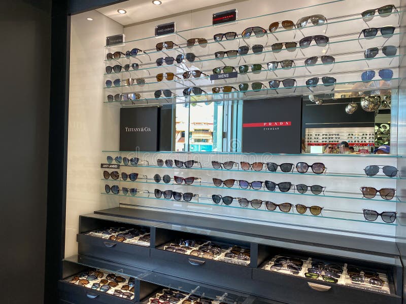 A Display of Prada Eyewear, Tiffany & Co., and Dolce & Gabbana Sunglasses  at Sunglass Hut Retail Store at a Mall Editorial Stock Image - Image of  retail, background: 174249889