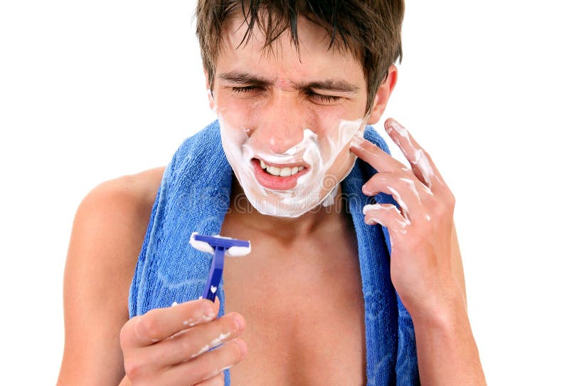 Displeased Young Man shaving stock photo Displeased Young Man shaving stock photo