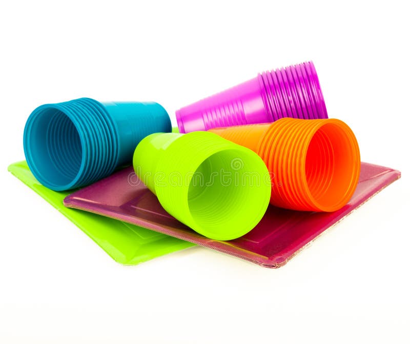 Closeup shot of stacks of red and green plastic cups isolated on a