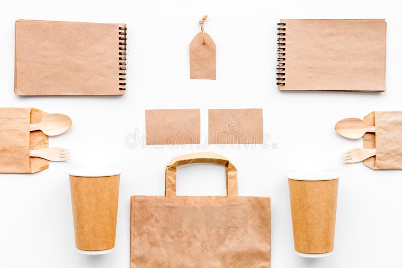 Disposable Tableware. Paper Cup, Spoon, Fork Near Brown Paper Bag and