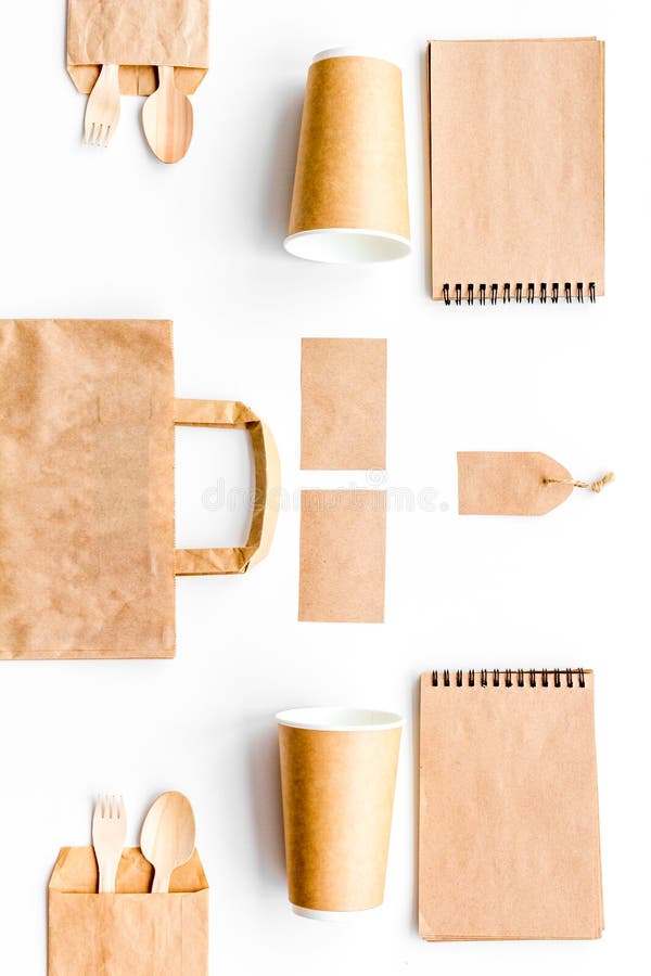Disposable Tableware. Paper Cup, Spoon, Fork Near Brown Paper Bag and