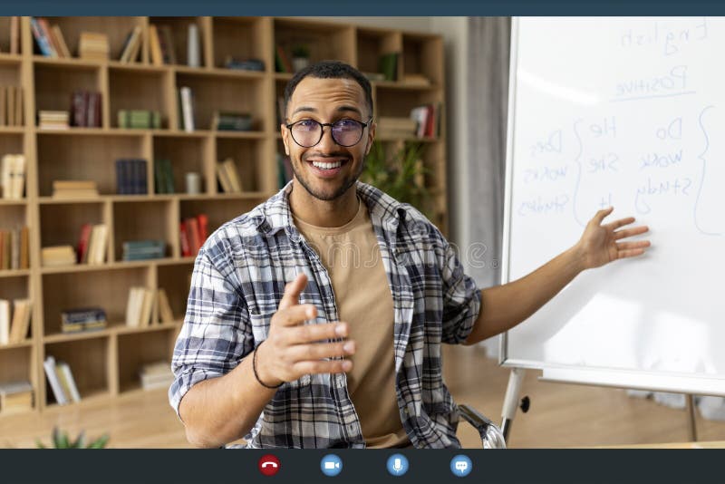 Distance education and technology. Young arab male teacher having video conference, having foreign languages lesson stock photos