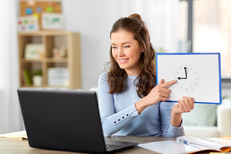 Teacher with Clock Having Online Class at Home Stock Photo Image of