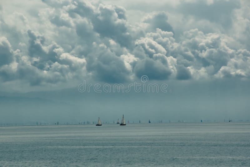 Distant sailboats on lake