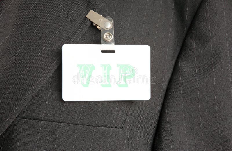 Close up of black suit with VIP id card. Close up of black suit with VIP id card