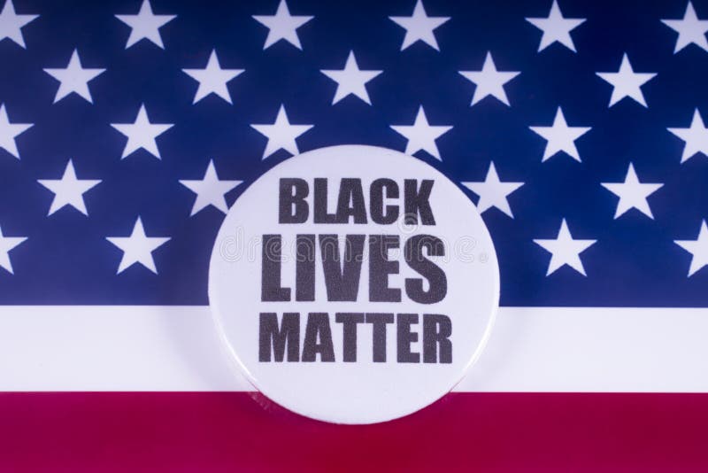 LONDON, UK - MARCH 18TH 2018: A Black Lives Matter badge over a US flag background, on 18th March 2018. BLM is an activist movement originating in the African-American community, campaigning against violence and racism towards black people. LONDON, UK - MARCH 18TH 2018: A Black Lives Matter badge over a US flag background, on 18th March 2018. BLM is an activist movement originating in the African-American community, campaigning against violence and racism towards black people.