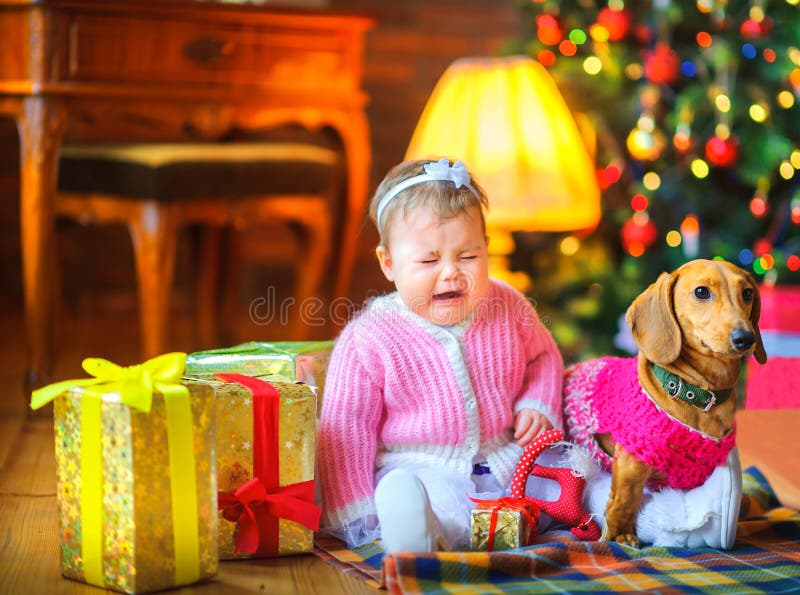 Distressed little girl crying sitting on the floor stock photography Distressed little girl crying sitting on the floor stock photography