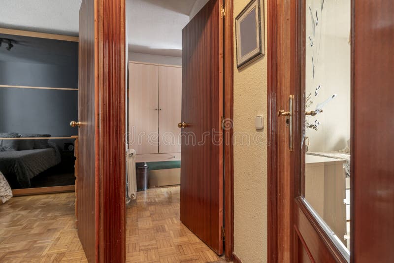 Distributor of a Home with Simple Sapelly Wood Doors Stock Image