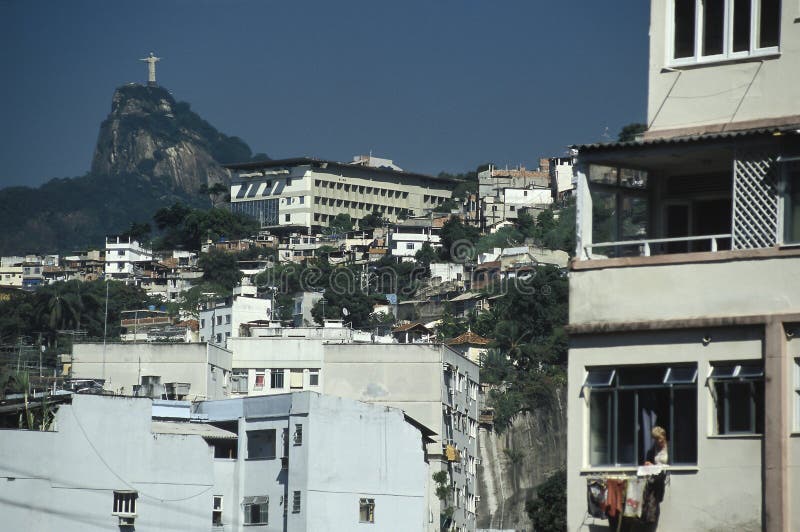 The statue of Christ the Redeemer on top of the Corcovado hill, Rio de Janeiro, Brazil, as seen from the Gloria district (in the central part of the city). The statue, 30m high and weighing over 1000 metric tons, was first planned to be completed in 1922 as part of Brazil’s centenary of independence celebrations. In fact it wasn’t finished until 1931, the French sculptor Paul Landowski respons. The statue of Christ the Redeemer on top of the Corcovado hill, Rio de Janeiro, Brazil, as seen from the Gloria district (in the central part of the city). The statue, 30m high and weighing over 1000 metric tons, was first planned to be completed in 1922 as part of Brazil’s centenary of independence celebrations. In fact it wasn’t finished until 1931, the French sculptor Paul Landowski respons