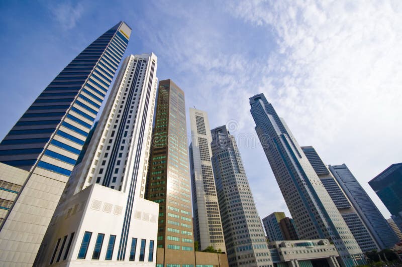 The tall office buildings towering in the central business district of Singapore. The tall office buildings towering in the central business district of Singapore.