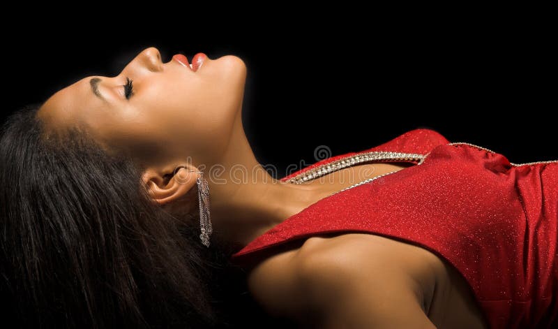 Woman lying on her back in elegant red dress. Woman lying on her back in elegant red dress