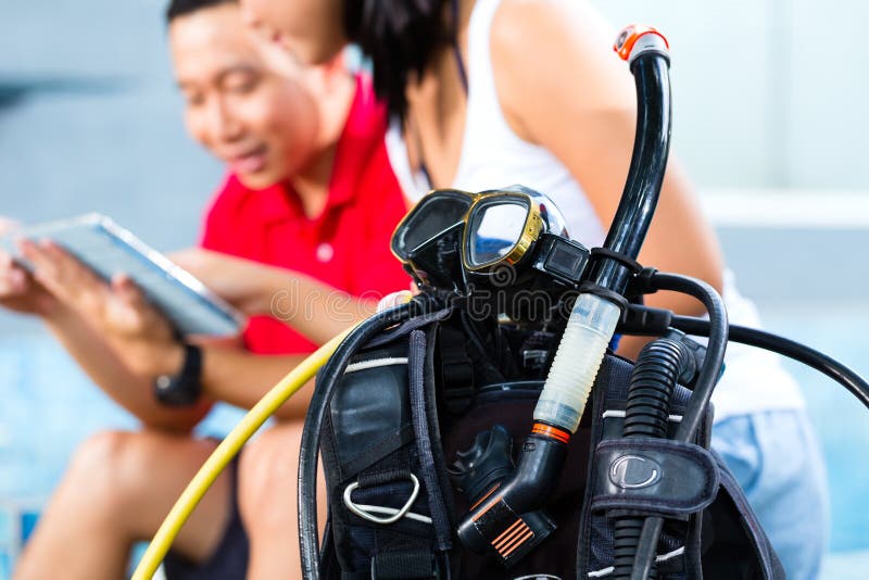 Dive master and student in Asian diving school stock photos Dive master and student in Asian diving school stock photos