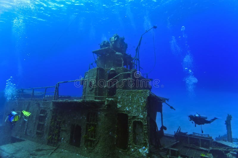 Divers exploring a shipwreck