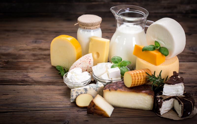 Various dairy products on the wooden background. Various dairy products on the wooden background