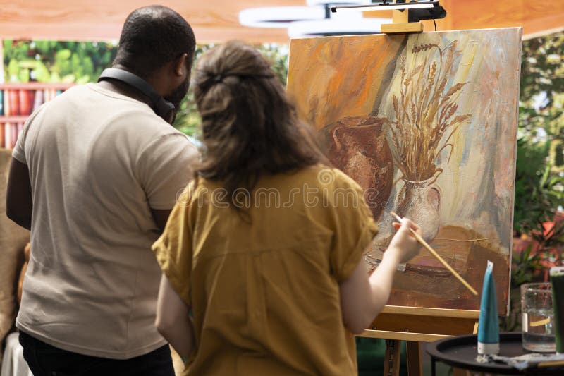 Diverse artists using oil paints to create a beautiful masterpiece royalty free stock images