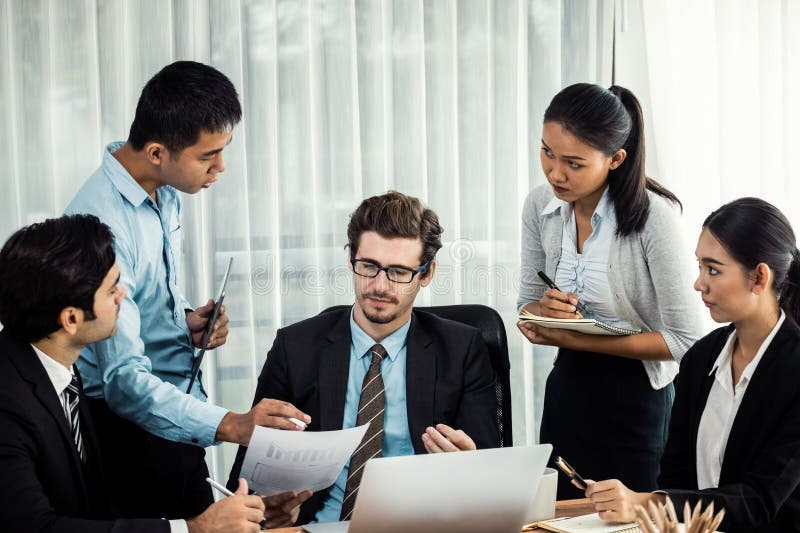Diverse of business people discuss business. Meticulous royalty free stock image