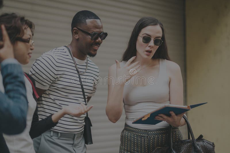 Diverse business team brainstorming ideas in an urban outdoor setting royalty free stock photo