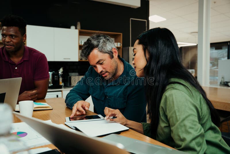 Diverse business team gather together to discuss important project before presentation in front of clients stock photos