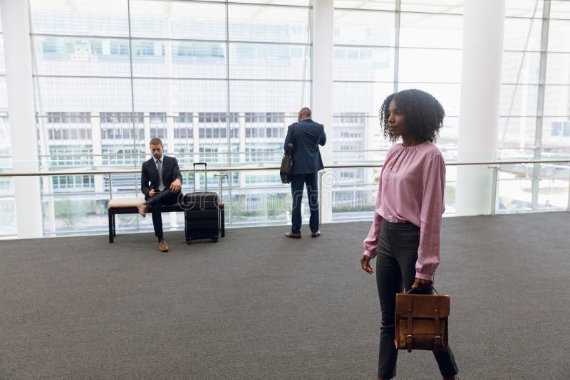 Diverse business travallers waiting stock photography Diverse business travallers waiting stock photography