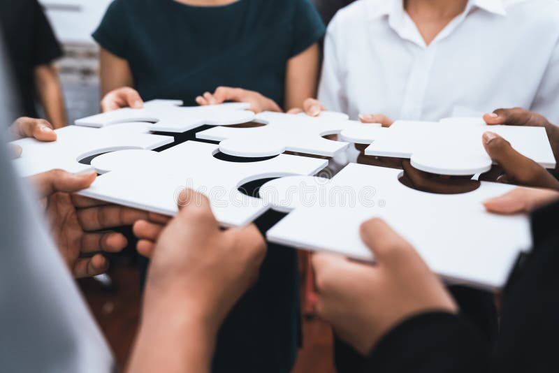 Diverse corporate officer workers connecting puzzle pieces. Concord royalty free stock photography