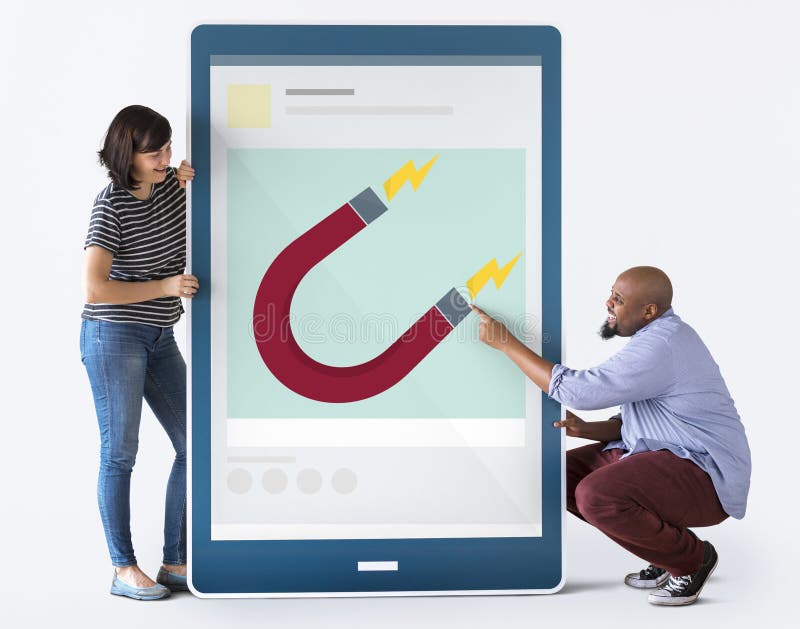 Diverse couple holding a tablet with graphics royalty free stock photo