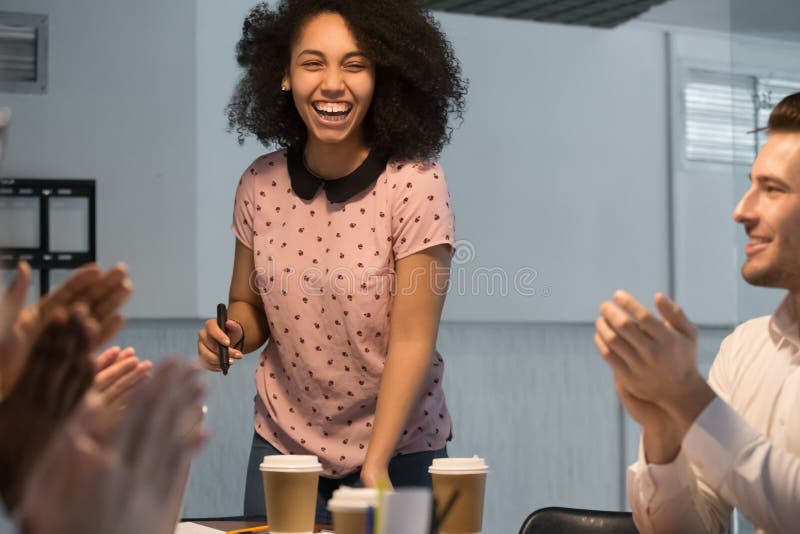 Diverse employees applaud thanking happy black female presenter stock photos Diverse employees applaud thanking happy black female presenter stock photos