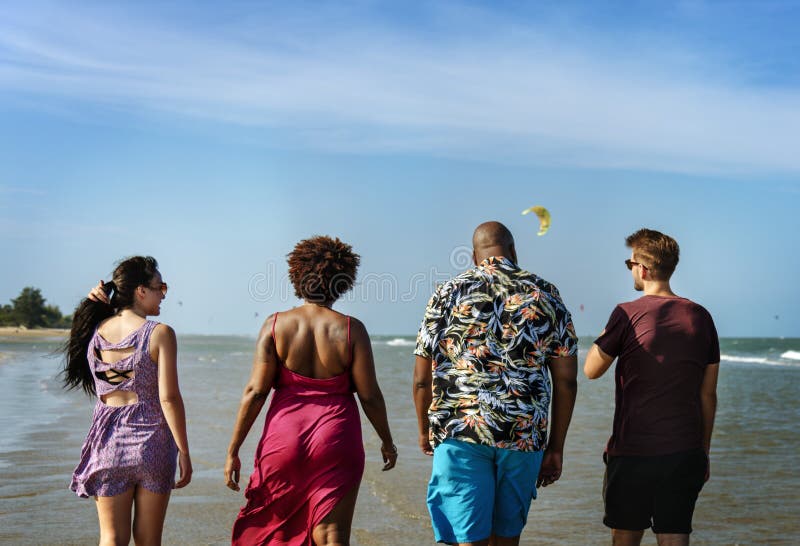 Diverse friends having fun at the beach royalty free stock photos
