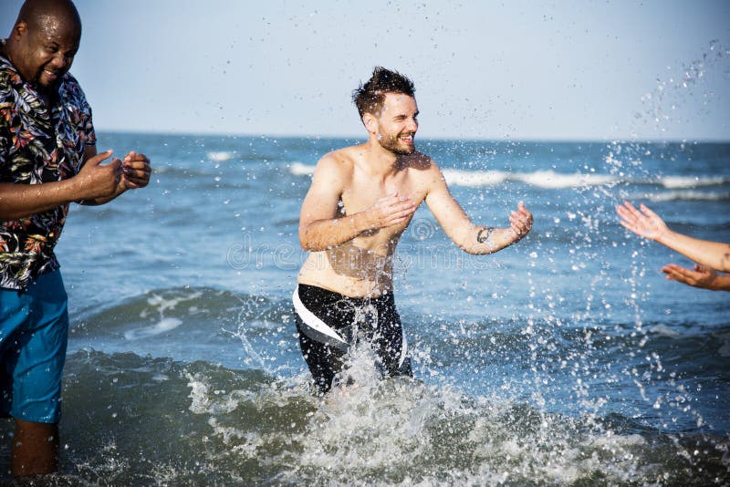 Diverse friends having fun on the beach royalty free stock photo