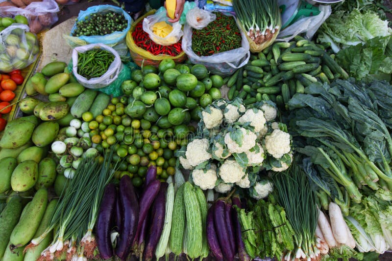 Various vegetables on the Asian food market, with cauliflower, cucumbers, eggplants, chili, and bok choi. Various vegetables on the Asian food market, with cauliflower, cucumbers, eggplants, chili, and bok choi