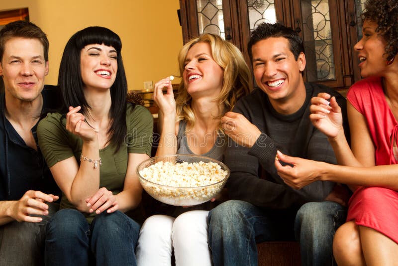 Diverse group of friends talking and laughing. 