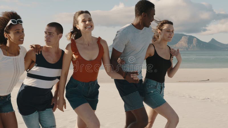 Friends enjoying walking at the beach