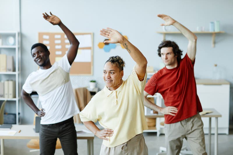 Group Exercises in Office stock image. Image of activity 258829607