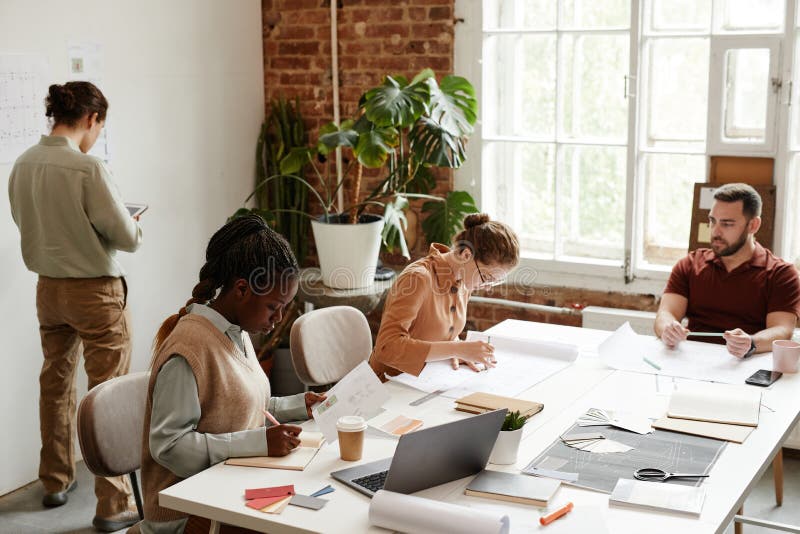 Diverse Team of Architects in Office stock images