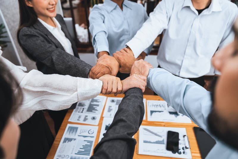 Diverse team of officer worker hold hand in circle at corporate office. Concord royalty free stock image