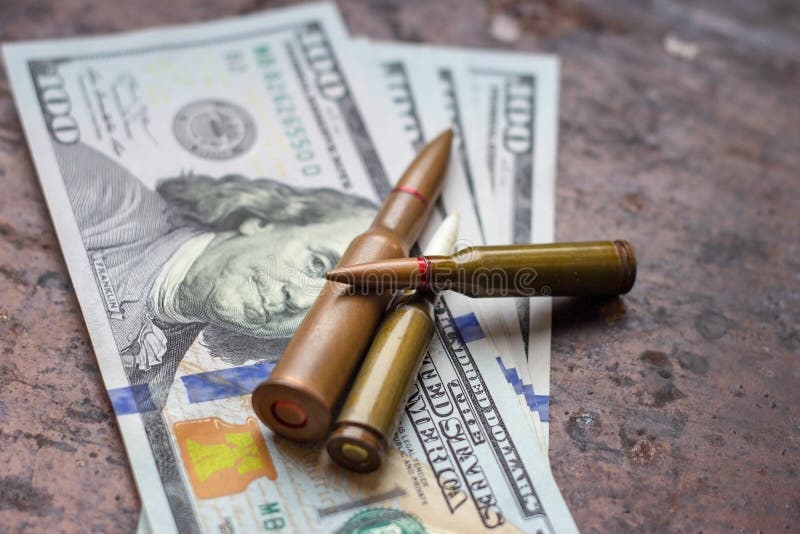 Diverse weapon bullets on American dollars background. Military industry, war, global arms trade and crime concept. stock photos Diverse weapon bullets on American dollars background. Military industry, war, global arms trade and crime concept. stock photos