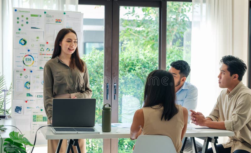 Diversity team presentation in ESG sustainability business goals sdgs in green office royalty free stock photo