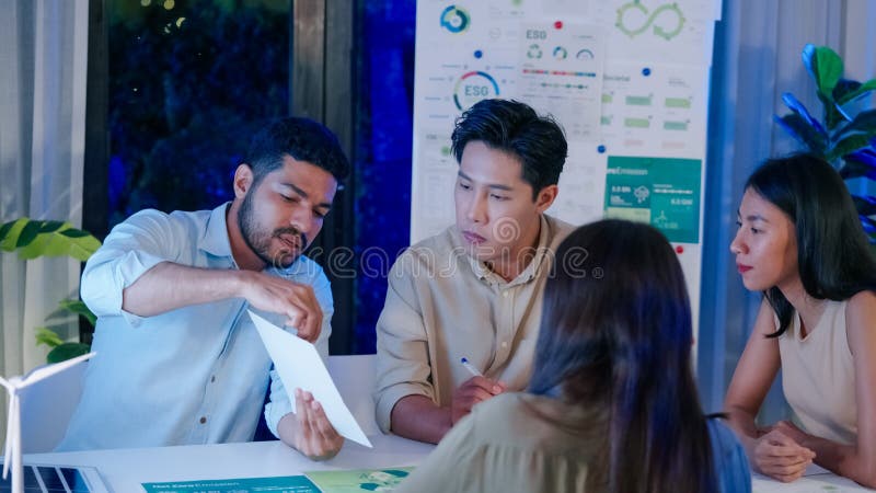Diversity team presentation about ESG sustainability business goals sdgs in green office stock photo