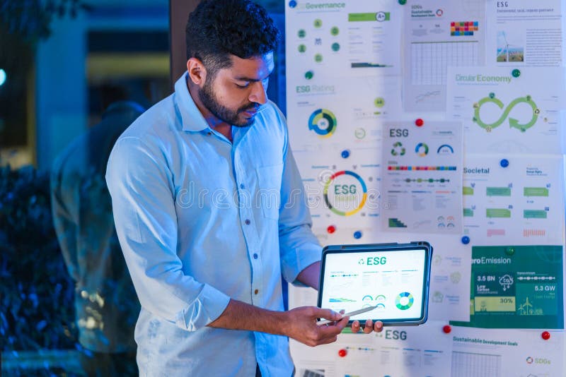 Diversity team presentation about ESG sustainability business goals sdgs in green office at night stock images