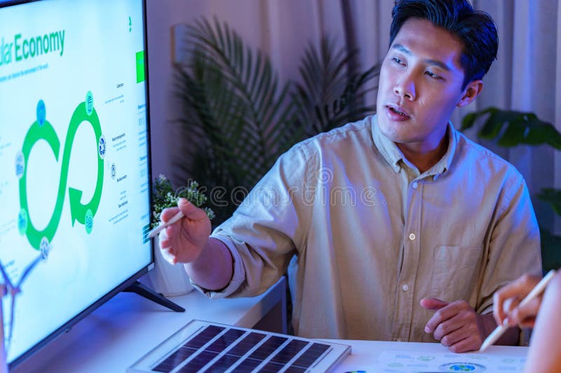 Diversity team presentation about ESG sustainability business goals sdgs in green office at night stock photo
