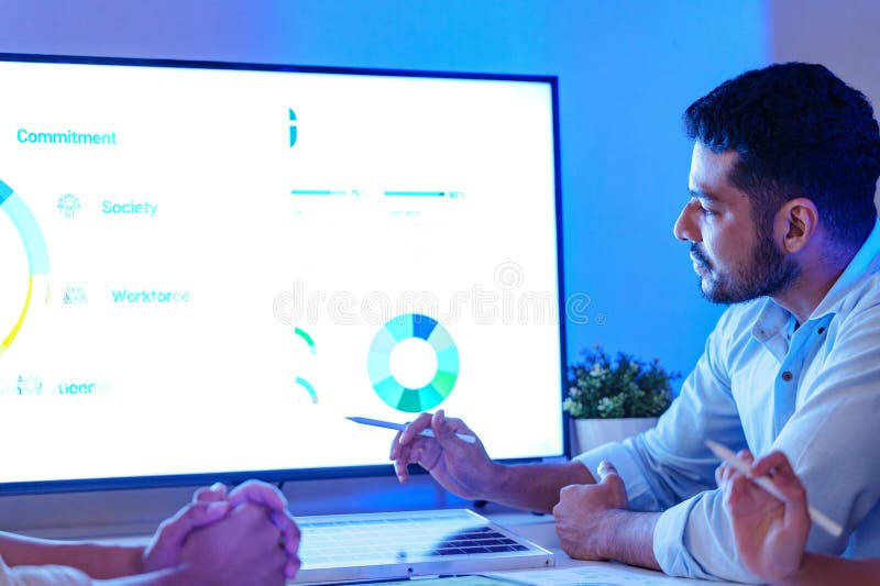 Diversity team presentation about ESG sustainability business goals sdgs in green office at night stock photos